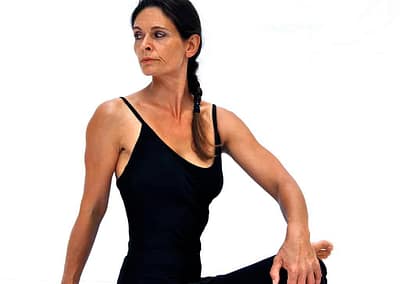Parivrtta-agnistambhasana-fire-log-pose-in-twist-Opale-Yoga-Ibiza